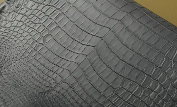 What are the types of crocodile skin commonly used by luxury brands